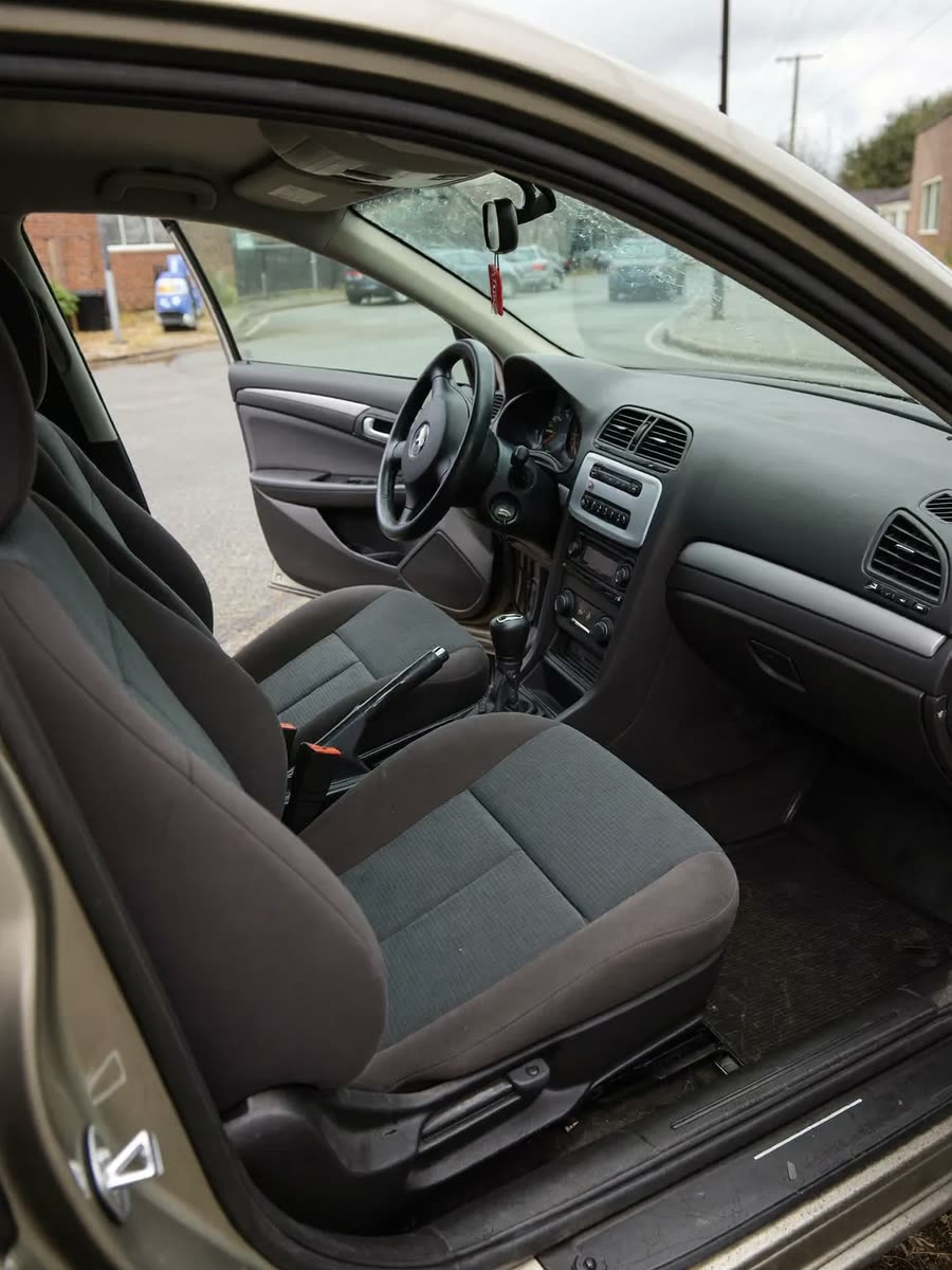 The cleaned interior of a car, seats and dashboard wiped down